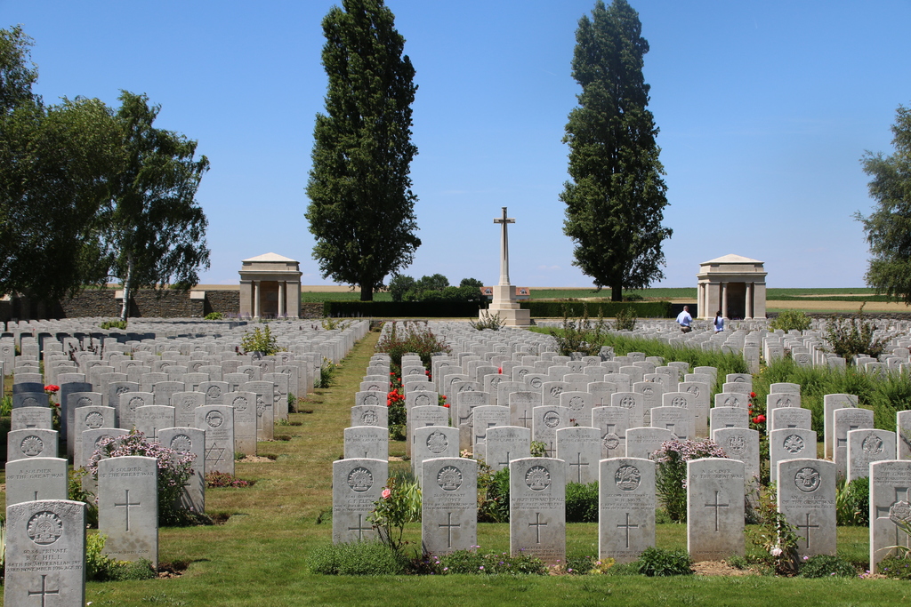 A.I.F. Burial Ground at Flers, Somme, France showcasing headstone lines and the Cross of Sacrifice