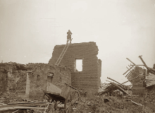 An artillery observation officer on top of a ruined wall at Havrincourt, 20 November 1917.