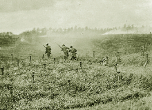 A British patrol on the move in a field of barbed wire.