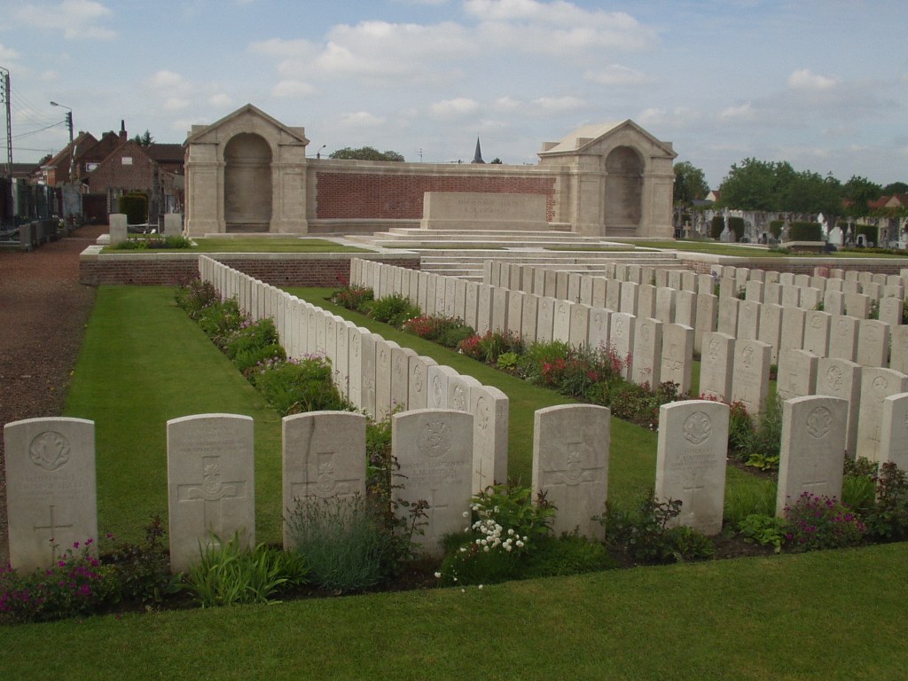 Immaculate stone rows extending across green lawns at Noeux-les-Mines Communal Cemetery, France
