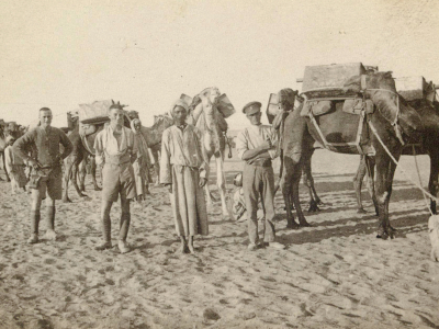 British soldiers with members of the Egyptian Camel Transport Corps, carrying water for troops, Sheik Nakhrur, 1917.